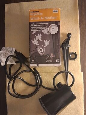 Gemmy Whirl-A-Motion Halloween Projection Light - Black and Orange